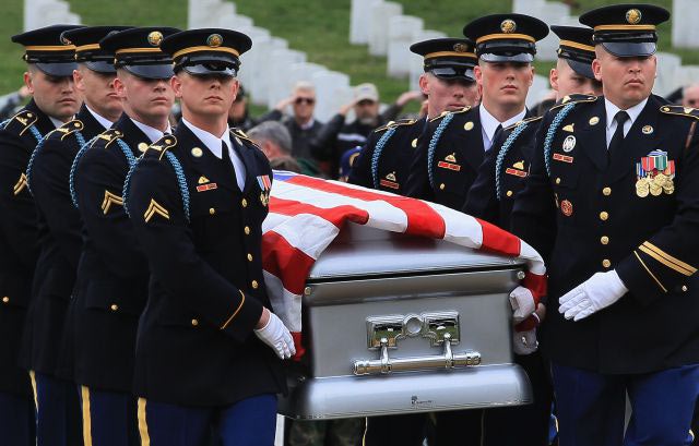 ARLINGTON, VA - MARCH 15: A military honor guard carries the casket of Army Corporal Frank Buckles, during a funeral service at Arlington National Cemetery, on March 15, 2011 in Arlington, Virginia. Buckles who was the last verified American veteran of World War I, died on February 27, 2011 at the age of 110. Buckles quit school at the age of 16 and lied to enlist in the U.S. Army, he then traveled across the Atlantic to the European theater on the British liner the Carpathia where he served in England and France, driving ambulances and motorcycles for the Army's 1st Fort Riley Casual Detachment. He will be buried with full military honors today. (Photo by Mark Wilson/Getty Images)