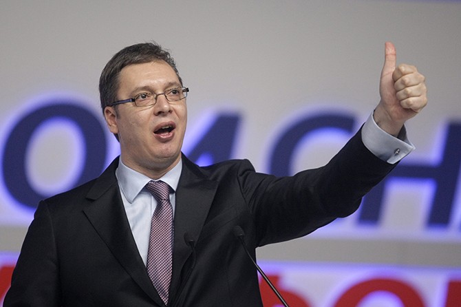 epa04120543 Aleksandar Vucic, the leader of the Serbian Progressive Party gives a thumb up gesture during a pre-election rally in Belgrade, Serbia, 11 March 2014. Parliamentary elections will be held in Serbia on 16 March 2014. EPA/ANDREJ CUKIC